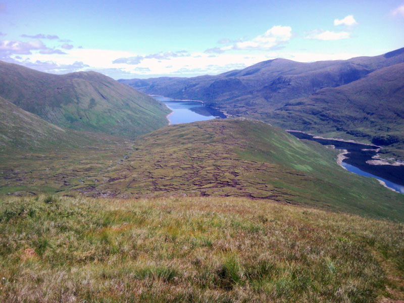 View down loch mullardoch with the peat hags and the loch shoreline
